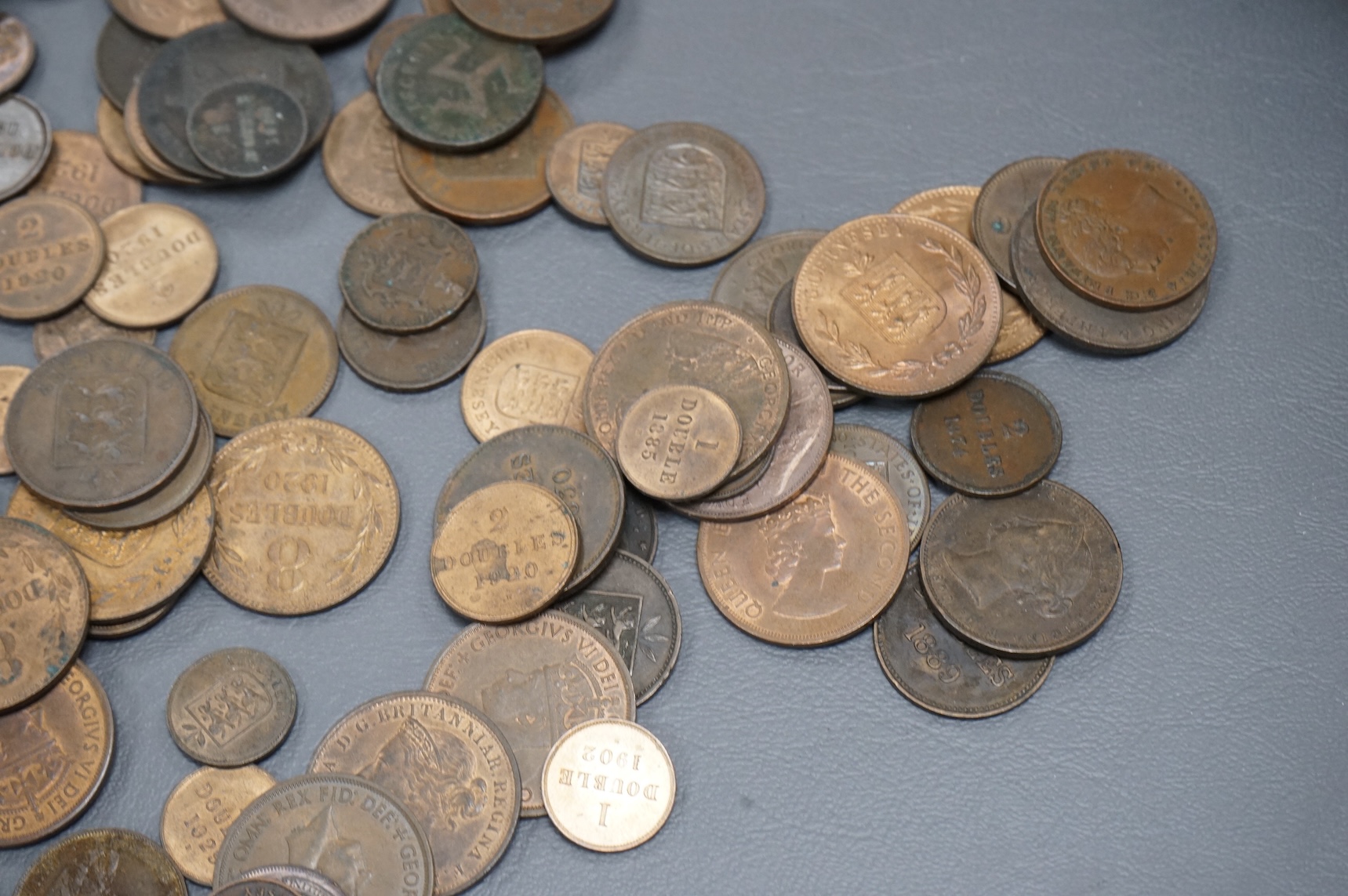 A collection of Guernsey and Channel Islands coins, Victoria to George V, many EF to UNC, Together with a C. Brooke rajah Sarawak, one cent, 1870, about EF